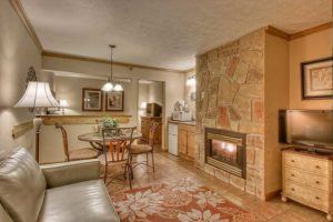 living area with fireplace in hotel suite at Willow Brook