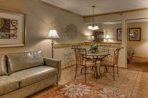 sofa and dining table in suite at Willow Brook Lodge