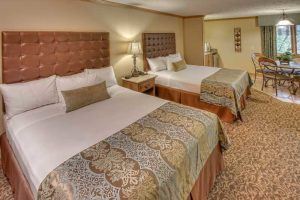 hotel room in Pigeon Forge with two queen beds at Willow Brook Lodge