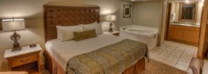 King bed in jacuzzi suite at Willow Brook Lodge in Pigeon Forge Tn