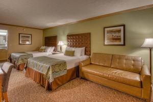 hotel room with two queen beds at Willow Brook Lodge Pigeon Forge Tn