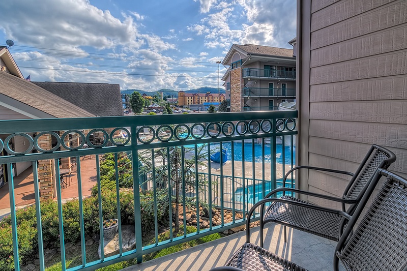Beautiful view of pool and mountains from balcony at Willow Brook Lodge