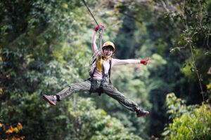 excited girl on zipline attraction in Pigeon Forge TN