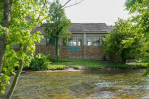 Exterior view of Willow Brook Lodge motel next to River Walk and LeConte Center in Pigeon Forge, Tennessee